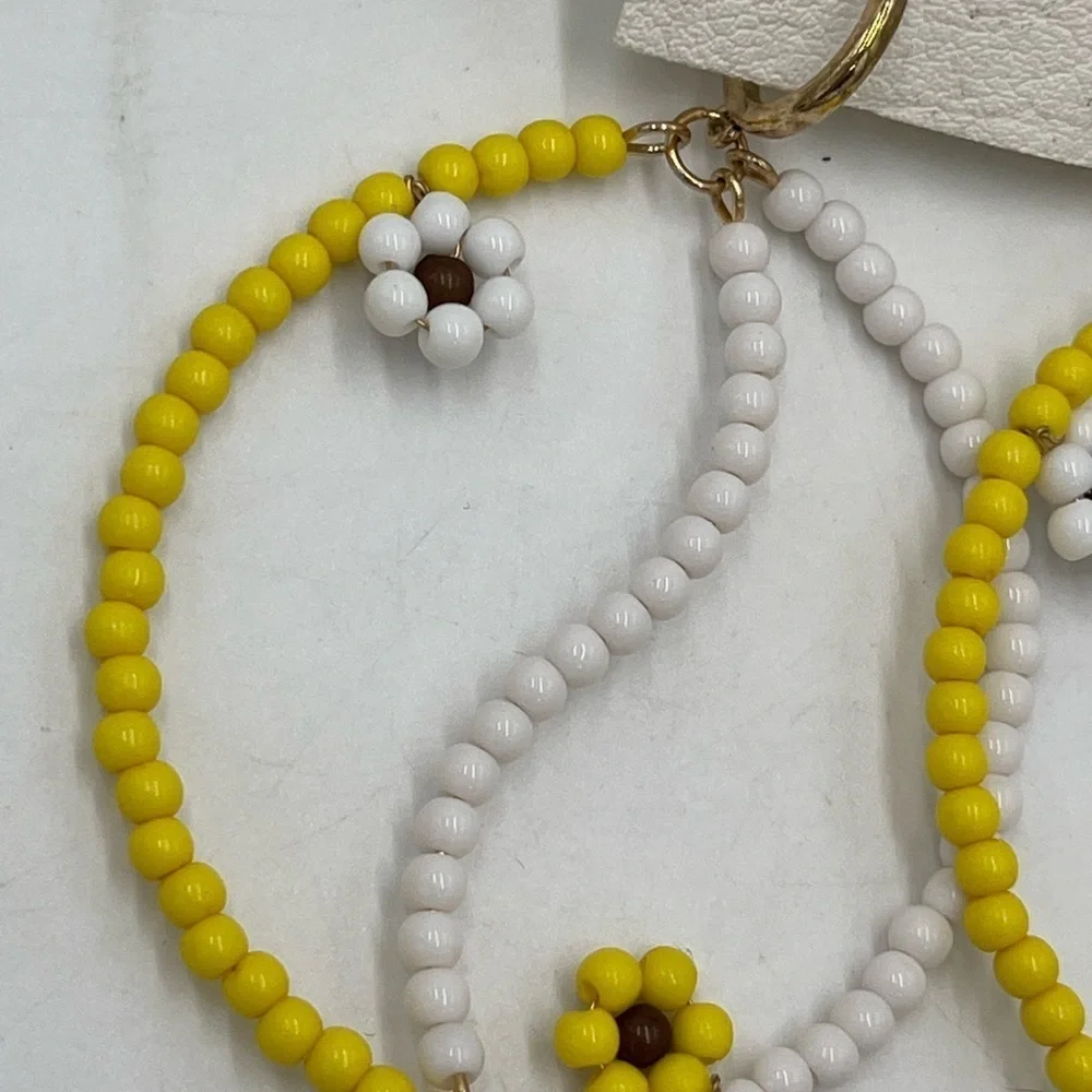 FREE PEOPLE AMONG THE‎ WILDFLOWERS HOOP YIN AND YANG YELLOW/WHITE  EARRINGS